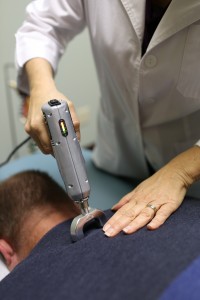 Chiropractic spinal adjustment with the Impulse iQ instrument
