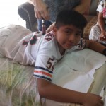 A young Mexican boy getting Chiropractic treatment